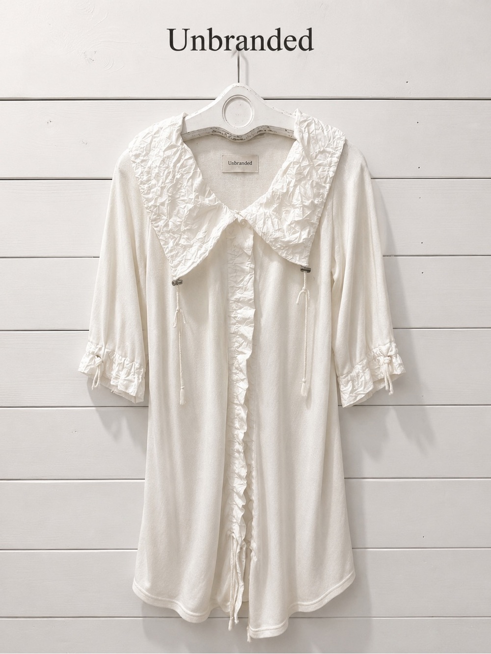 Unbranded off-white tunic with unique crinkled fabric , estimated size S/M.
